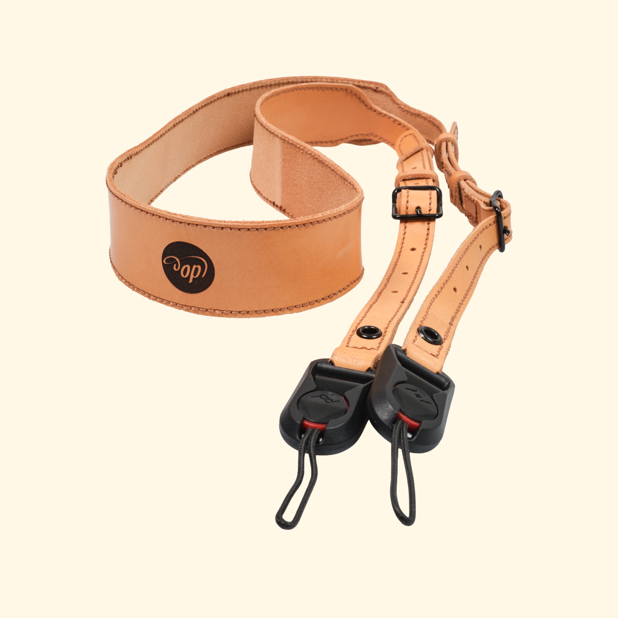 Leder-Kameragurt, nature, zusammengelegt mit op-Logo und Peak Design Anchor Links